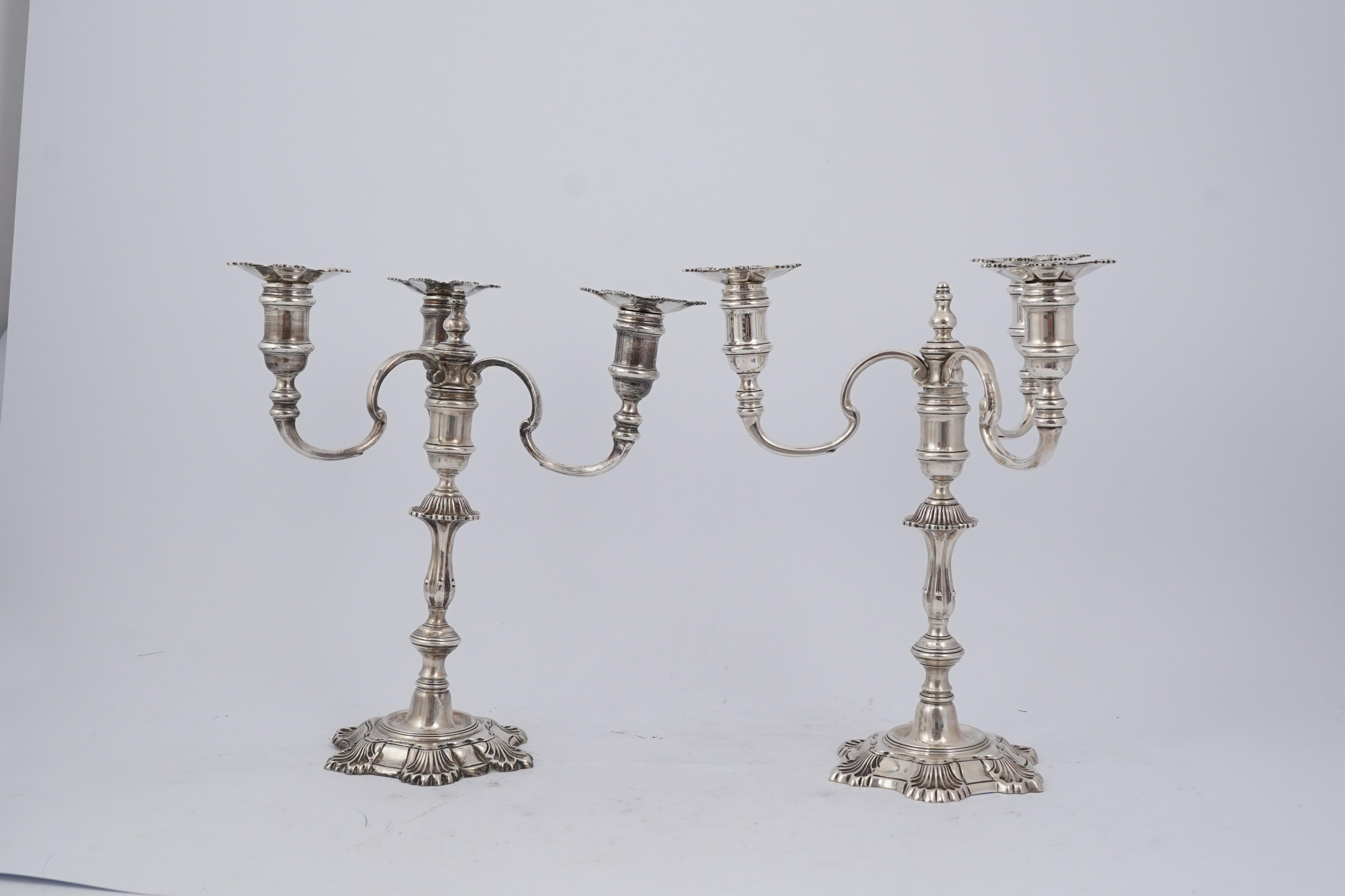 A pair of Elizabeth II cast silver three branch, three light candelabra, by J.B. Chatterley & Sons Ltd